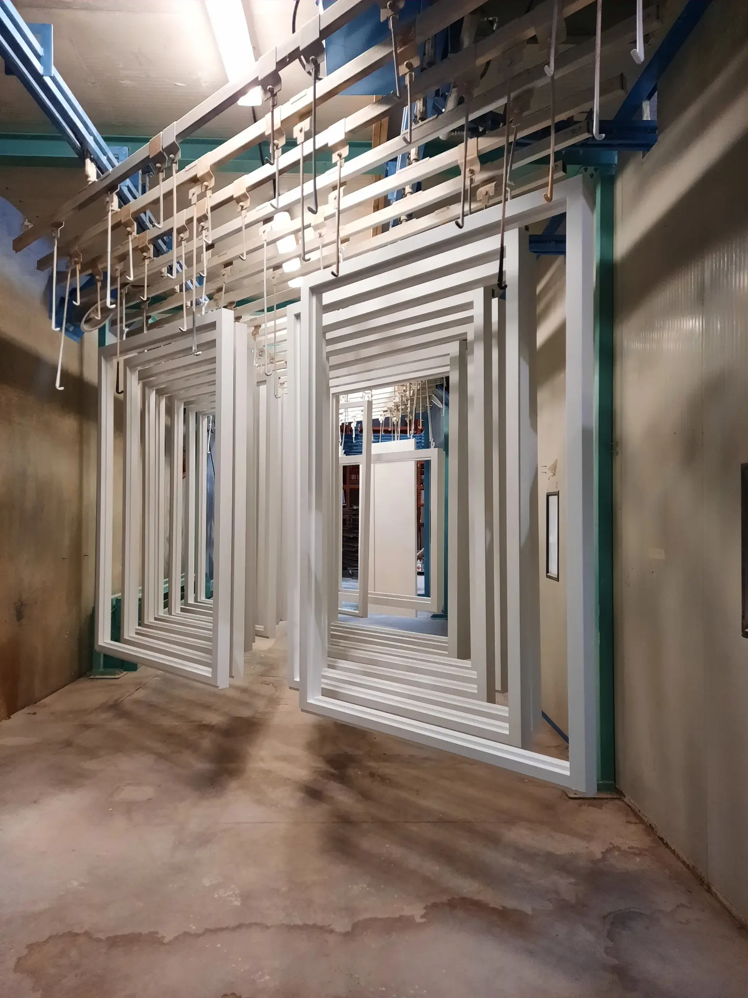 Wood window components being carefully finished in a bright workshop