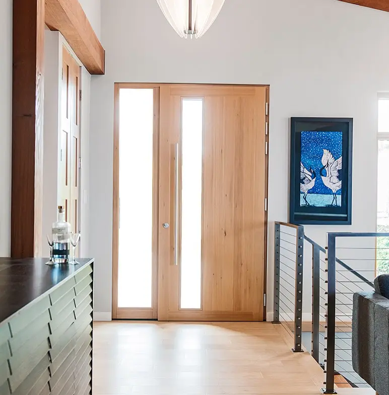 Bright custom Fenstür wood entry door with matching sidelite
